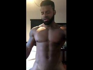 Dark-hued dude sings rap and dancing nude in front cam