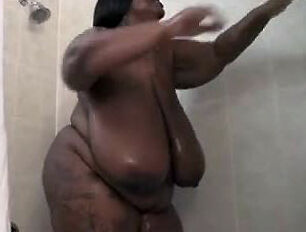This Meaty dark-hued lady milks in the shower. Her meaty