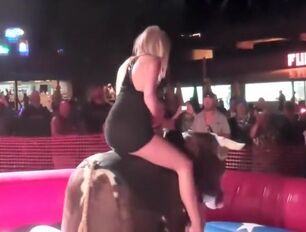 Provocative light-haired rails the mechanical bull