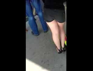 Spunk over lady in ebony cut-offs in line for tickets
